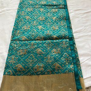 Peacock green silk patola saree with blouse